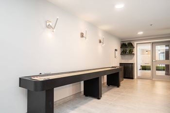 a pool table in a room with a door